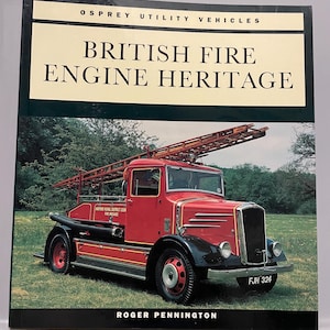 May include: A book titled "British Fire Engine Heritage" by Roger Pennington. The cover features a vintage red fire engine with a ladder on top, parked on grass. The book is part of the Osprey Utility Vehicles series.