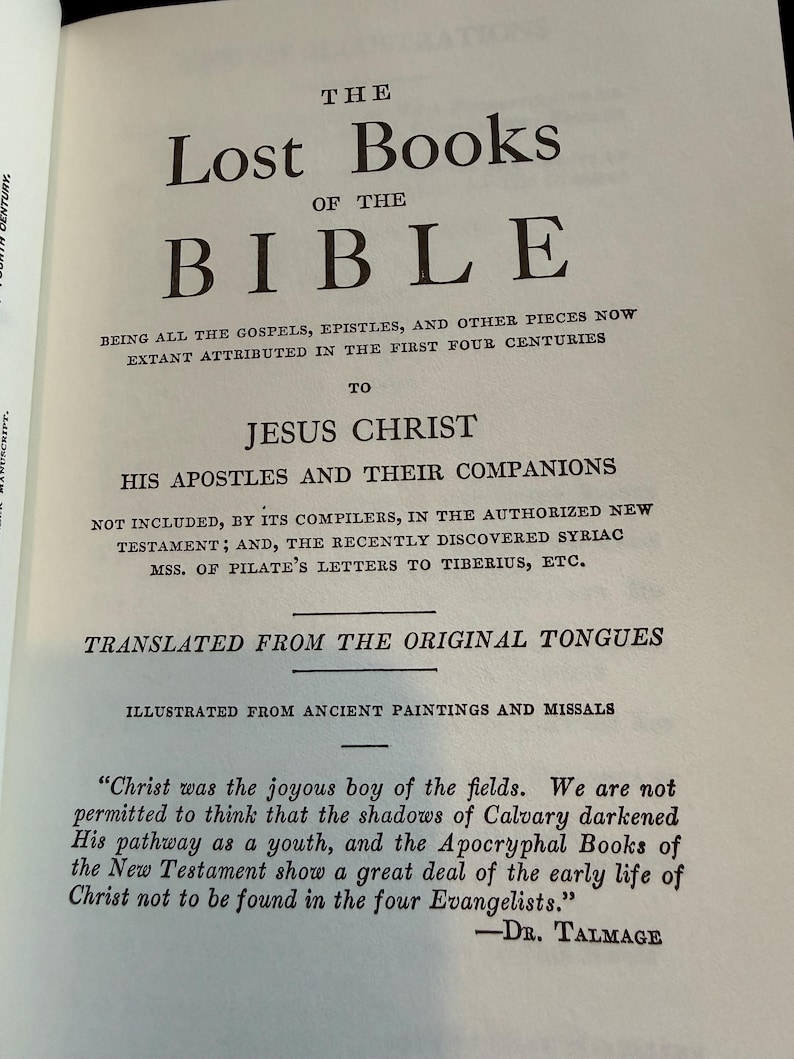 May include: A page from "The Lost Books of the Bible" is displayed, with the title in large, black, bold font. The text describes the book's contents and translation, with a quote from Dr. Talmage at the bottom.