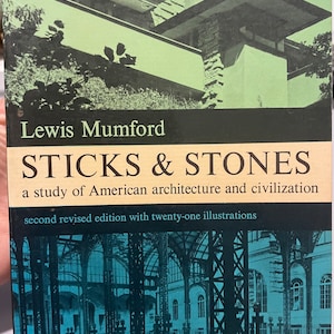 May include: A vintage book cover featuring a green and white image of a building. The title is "STICKS & STONES" by Lewis Mumford. The subtitle is "a study of American architecture and civilization". The book is a second revised edition with twenty-one illustrations.