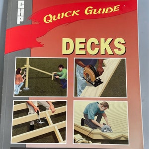 May include: A book titled "Quick Guide Decks" by Creative Homeowner Press. The book cover features a red banner with the title "Quick Guide" and illustrations of people building a deck.