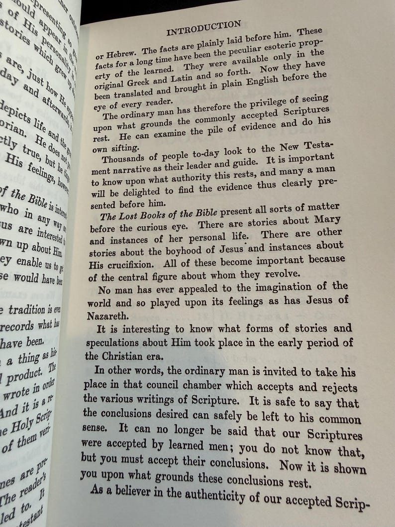 May include: An open book displaying the title "INTRODUCTION" and text discussing the translation of ancient texts. The pages are aged, with black text. The text explores the importance of examining the Scriptures.