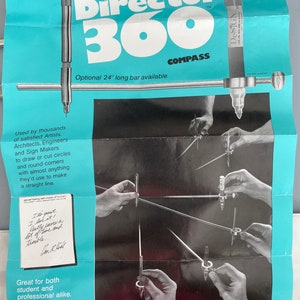 May include: A blue and white poster advertising the Director 360 Compass. The poster shows a person using the compass to draw circles and lines. The text on the poster reads "Director 360 Compass" and "Optional 24" long bar available".