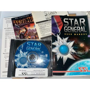 May include: A selection of retro computer game items, including a CD-ROM, user manual, and game box. The CD-ROM is labelled "Star General" with a blue and silver design. The user manual has a black cover with the game title and a star graphic.