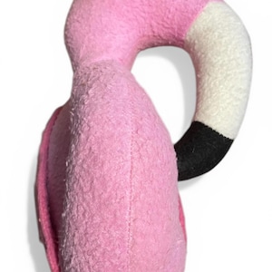 May include: A white ceramic mug with a black handle and the text "But First, Coffee" in a black, handwritten-style font. The mug is on a white surface.