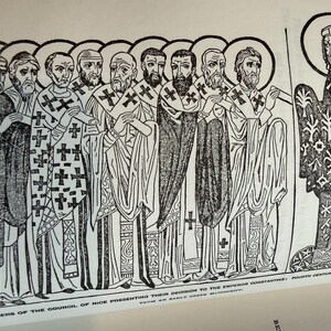 May include: A black and white illustration showing robed figures with halos presenting a scroll to a man. The figures hold crosses. The text at the bottom reads "MEMBERS OF THE COUNCIL OF NICE PRESENTING THEIR DECISION TO THE EMPEROR CONSTANTINE".