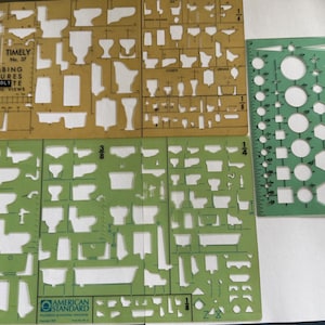 May include: Three vintage drafting templates in shades of green and tan. The templates feature cut-out shapes of plumbing fixtures, geometric shapes, and a ruler. One template reads "TIMELY Plumbing Fixtures Reinholdte Elevation Views".