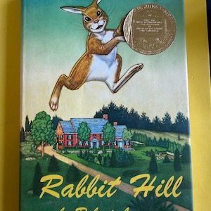 Rabbit Hill hardcover dust jacket 1966 tells the story of the animals living on the Hill and their anticipation humans moving into big house
