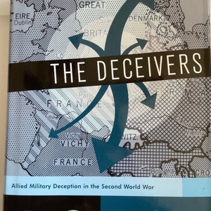 May include: Book cover with a blue and white map of Europe with arrows pointing to different locations. The title of the book is "The Deceivers: Allied Military Deception in the Second World War" by Thaddeus Holt.