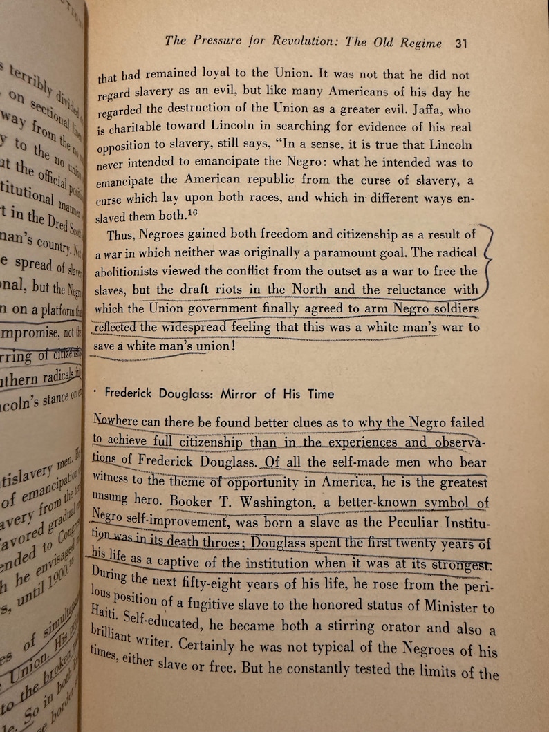 Op de afbeelding: Open boek met tekst over de Burgeroorlog en Frederick Douglass. De tekst bespreekt de emancipatie van slaven en de rol van zwarte soldaten. Het boek is geopend op pagina 31.