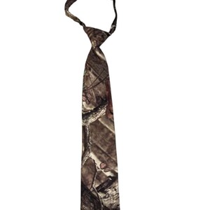 May include: A camouflage-patterned necktie in shades of brown, tan, and green. The tie is a standard length and features a classic knot design, suitable for formal or casual wear. The tie is made of a smooth fabric.
