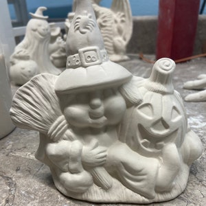 Ceramic bisque witch with pumpkin ready to paint