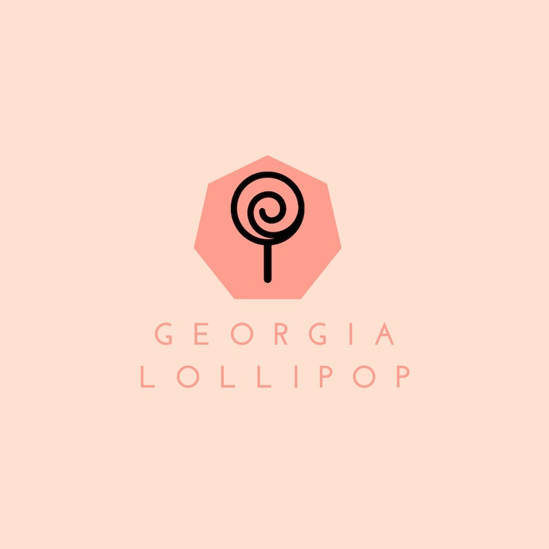 May include: A pink hexagonal logo with a black outline. Inside the hexagon is a black line drawing of a lollipop. Below the hexagon is the text "GEORGIA LOLLIPOP".
