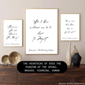 May include: Three framed art prints with quotes from The Phantom of the Opera. The prints have gold frames and white backgrounds with black script. The bottom of the image has text that reads "THE HEARTACHE OF ERIK THE PHANTOM OF THE OPERA: MASKED. YEARNING. HUMAN."