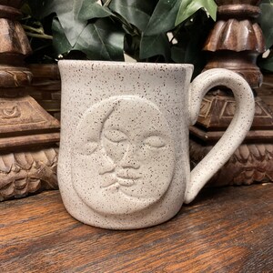 Holds 16 oz.  Handmade Celestial Moon and Sun pottery coffee mug, cup, tea cup. Microwave and dishwasher safe.  Unique gift. Ready to ship