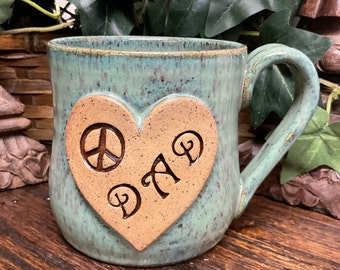 Holds 16 oz. Handmade Dad Peace Sign pottery coffee mug, tea cup.  Microwave and dishwasher safe. Ready to ship.  Great gift.