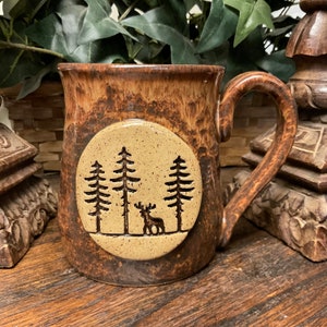 Holds 16 oz.  Handmade Rustic, Deer stoneware pottery coffee mug, cup, beer mug. Microwave, dishwasher safe. Ready to ship. Great gift