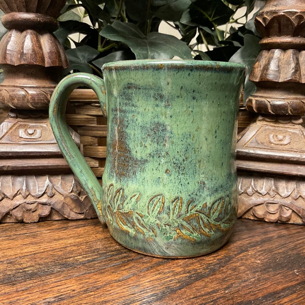 Holds 16 oz.  Handmade Vine, Flowers textured pottery coffee mug, tea cup.  Dishwasher, microwave safe.  Great gift.  Ready to ship.