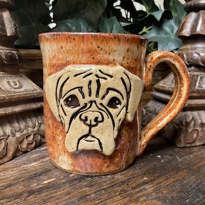 Holds 12 oz.  Handmade Rustic Boxer Dog pottery coffee mug, tea cup.  Pet lover. Microwave and dishwasher safe.  Unique gift.  Ready to ship