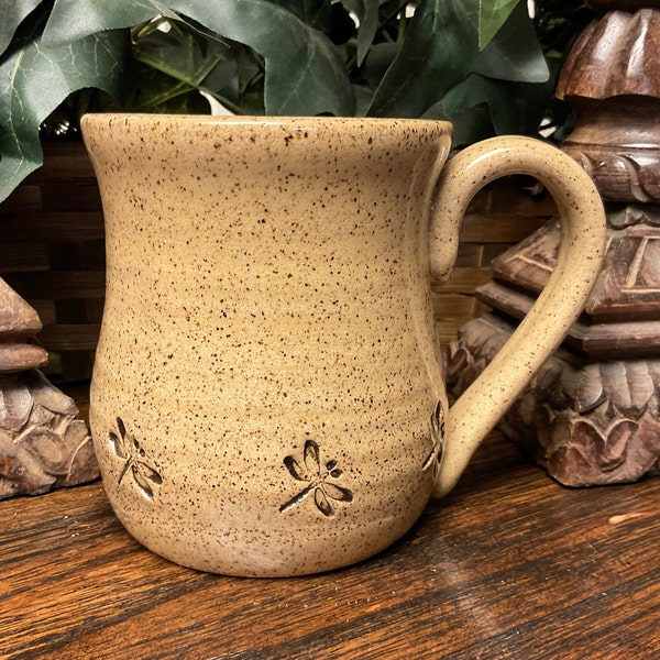 Holds 16 oz.  Handmade Dragonfly textured stoneware pottery coffee mug, tea cup.  Dishwasher and microwave safe.  Great gift.  Ready to ship