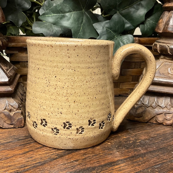 Holds 14 oz.  Handmade Paw Print Pet Lovers pottery coffee mug, tea cup. Microwave, dishwasher safe. Unique gift. Ready to ship