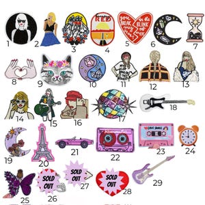 May include: A set of 29 iron-on patches featuring various designs, including a disco ball, a cassette tape, a guitar, a cat, a heart, a moon, a Eiffel Tower, a car, a butterfly, and a clock. The patches are colorful and have a variety of styles.