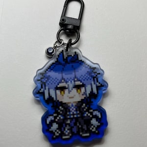 May include: A pixelated keychain featuring a character with blue hair and a black outfit. The keychain has a black clasp and a small charm. The character is set against a blue background.