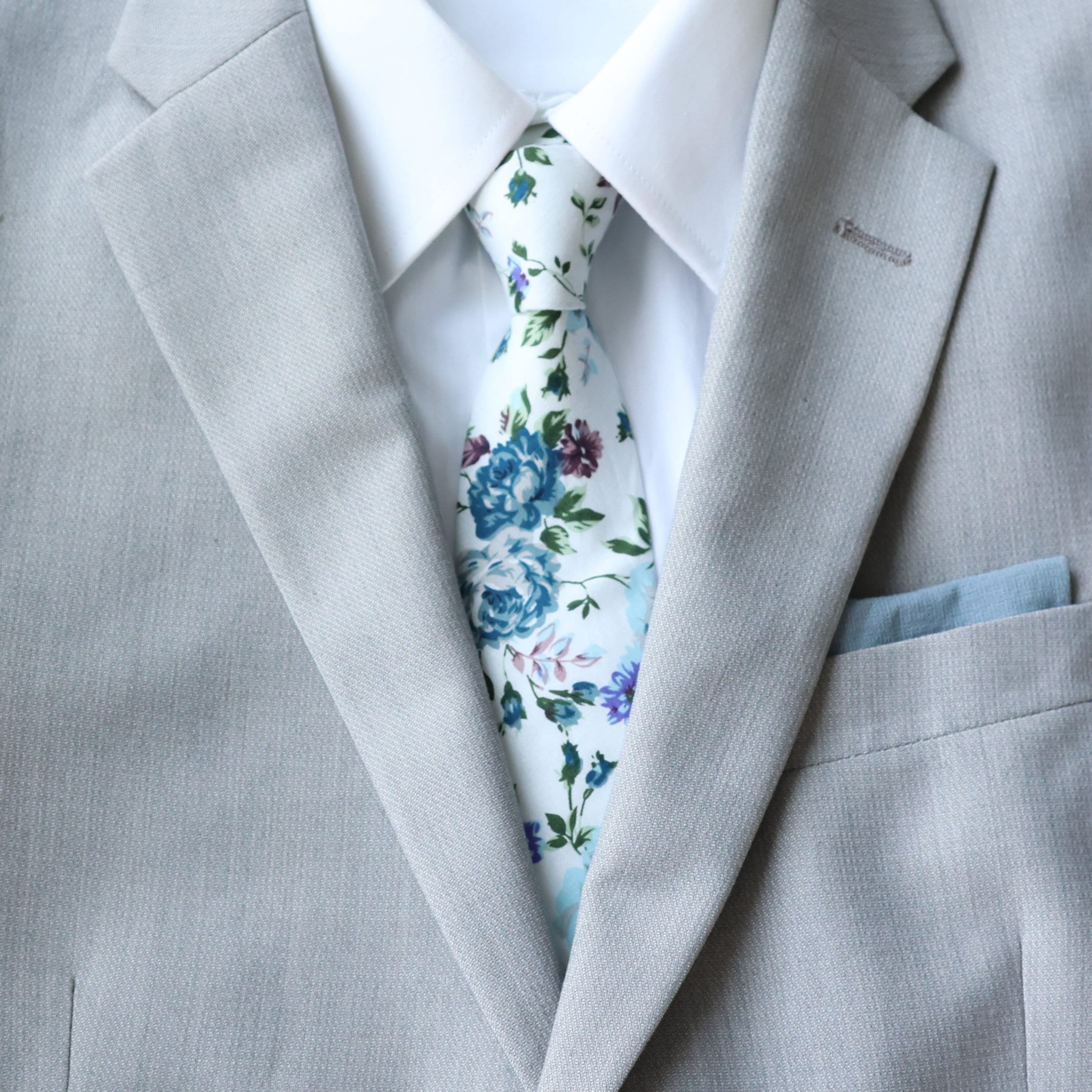 floral tie with grey suit