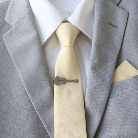Grey tux with yellow clearance bow tie