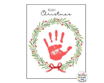 May include: A red handprint inside a green wreath with red berries. The wreath has a red bow at the bottom. The text "Merry Christmas" is at the top of the image. The text "My Billy Keepsake Art" is at the bottom of the image.