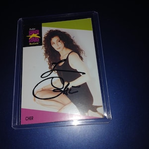 Gesigneerde Cher-kaart met COA