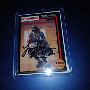 Larry Johnson autografou um cartão de avó com coa