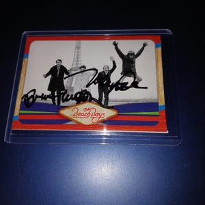 Carte des Beach Boys dédicacée par Brian Wilson et Mike Love avec un certificat d'identité