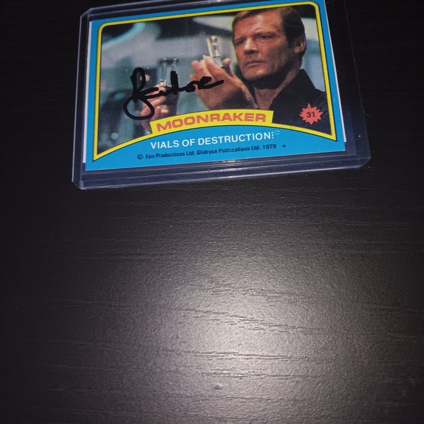 Roger Moore autographed card with coa