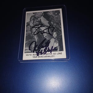 Jamie Lee Curtis, cartão autografado por Nick Castle com coa.