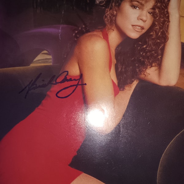 Mariah Carey autographed promo with coa.  Approximately 8x10 inches