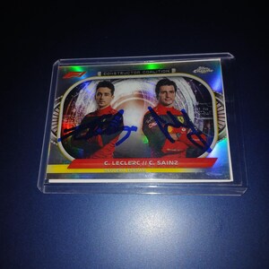 Carlos Sainz, Charles Leclerc autographed card with coa
