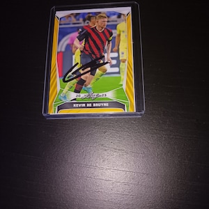 Cartão autografado por Kevin De Bruyne com cacau