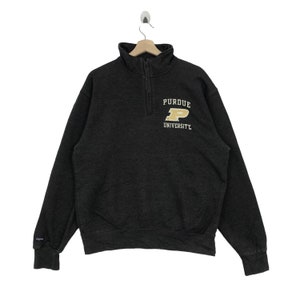 May include: A black 1/4 zip sweatshirt with a gold embroidered Purdue University logo on the chest.