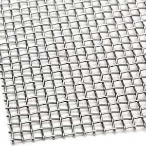 May include: Close-up of a stainless steel mesh screen. The screen is made of interwoven metal wires, forming a grid pattern. The mesh has a square pattern and a metallic silver color.
