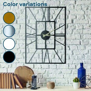 May include: Black metal wall clock with Roman numeral markings and a square frame. The clock is mounted on a white brick wall.