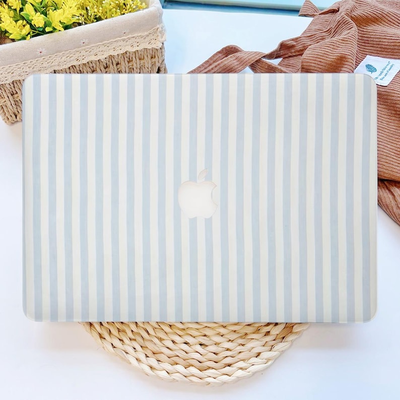 May include: A set of three ceramic mugs with a speckled, matte finish. The mugs are in shades of cream, light gray, and dark gray. Each mug has a simple, minimalist design and a rounded handle.