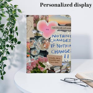 May include: A personalized display with a collage design. The design includes a pink heart with the number 444, disco balls, and text that reads "NOTHING CHANGES IF NOTHIN CHANGE". The display also features flowers and stars.