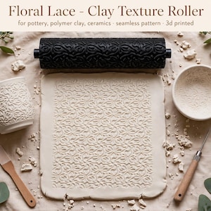 May include: A black cylindrical clay texture roller with a floral lace pattern, a rectangular slab of white clay with the same embossed pattern, a white ceramic mug, a small white bowl, and two sculpting tools with wooden handles.