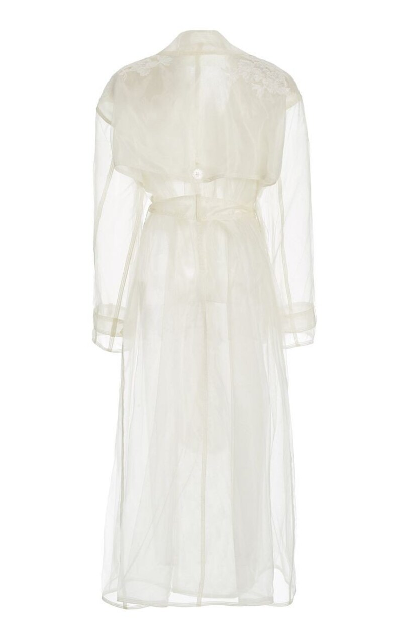 May include: A white sheer trench coat with a belt and long sleeves.