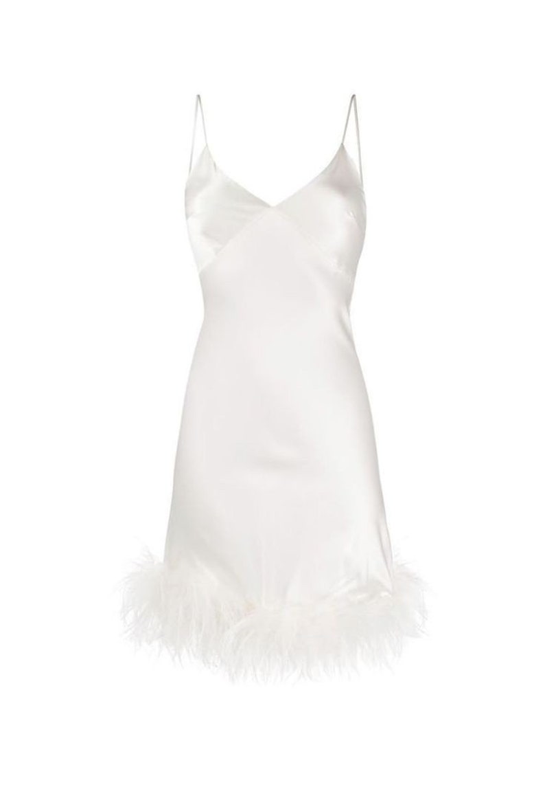 May include: A white slip dress with a feather trim. The dress has thin straps and a v-neckline.