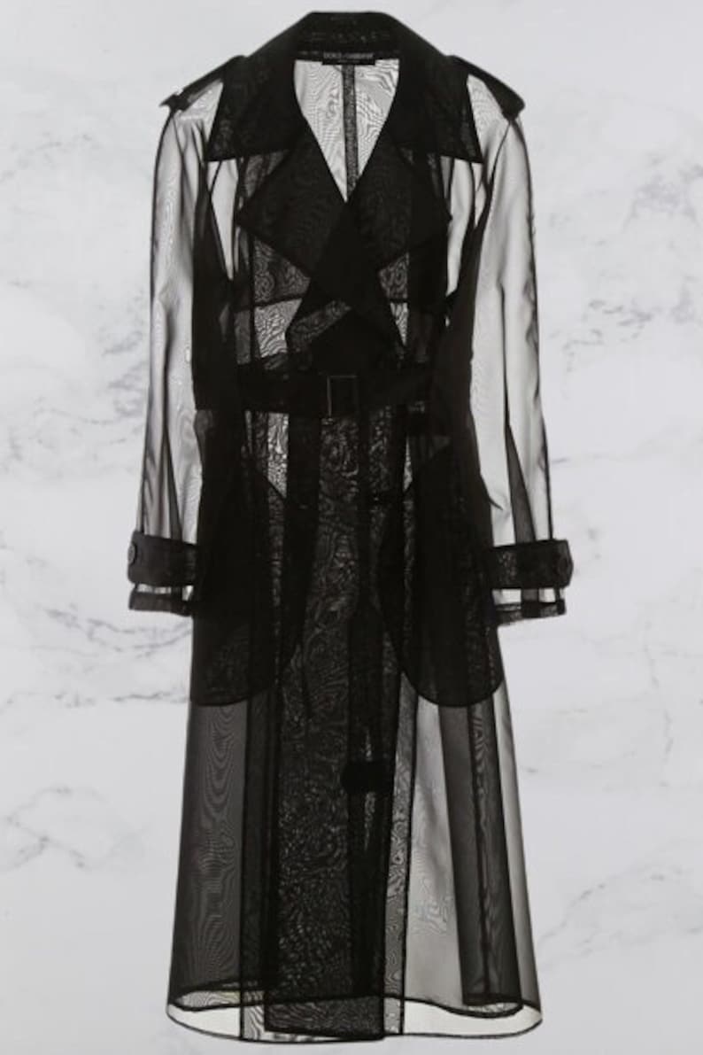 May include: A black sheer trench coat with a belted waist and a long, flowing silhouette.