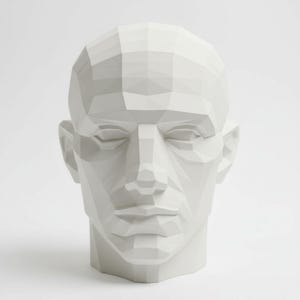 May include: A white, geometric sculpture of a human head. The head is rendered in a low-poly style, with numerous flat planes creating the form. The eyes are closed, and the lips are slightly parted. The sculpture is a solid, matte white.