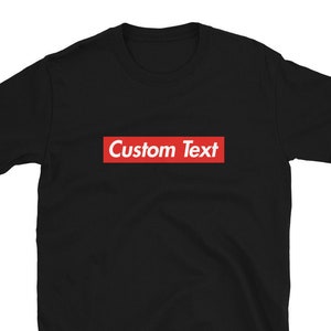 May include: Black t-shirt with a red box that says "Custom Text" on it.