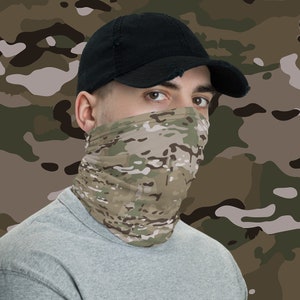May include: A person wearing a black baseball cap and a camouflage face covering. The face covering is a neck gaiter with a camouflage pattern.