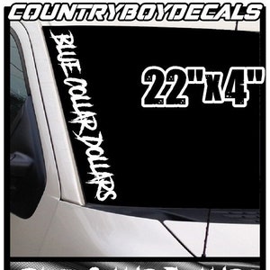 May include: White vinyl decal with the text "Blue Collar Dollars" in a stylized font. The decal is 22 inches by 4 inches and is shown on a black car windshield.
